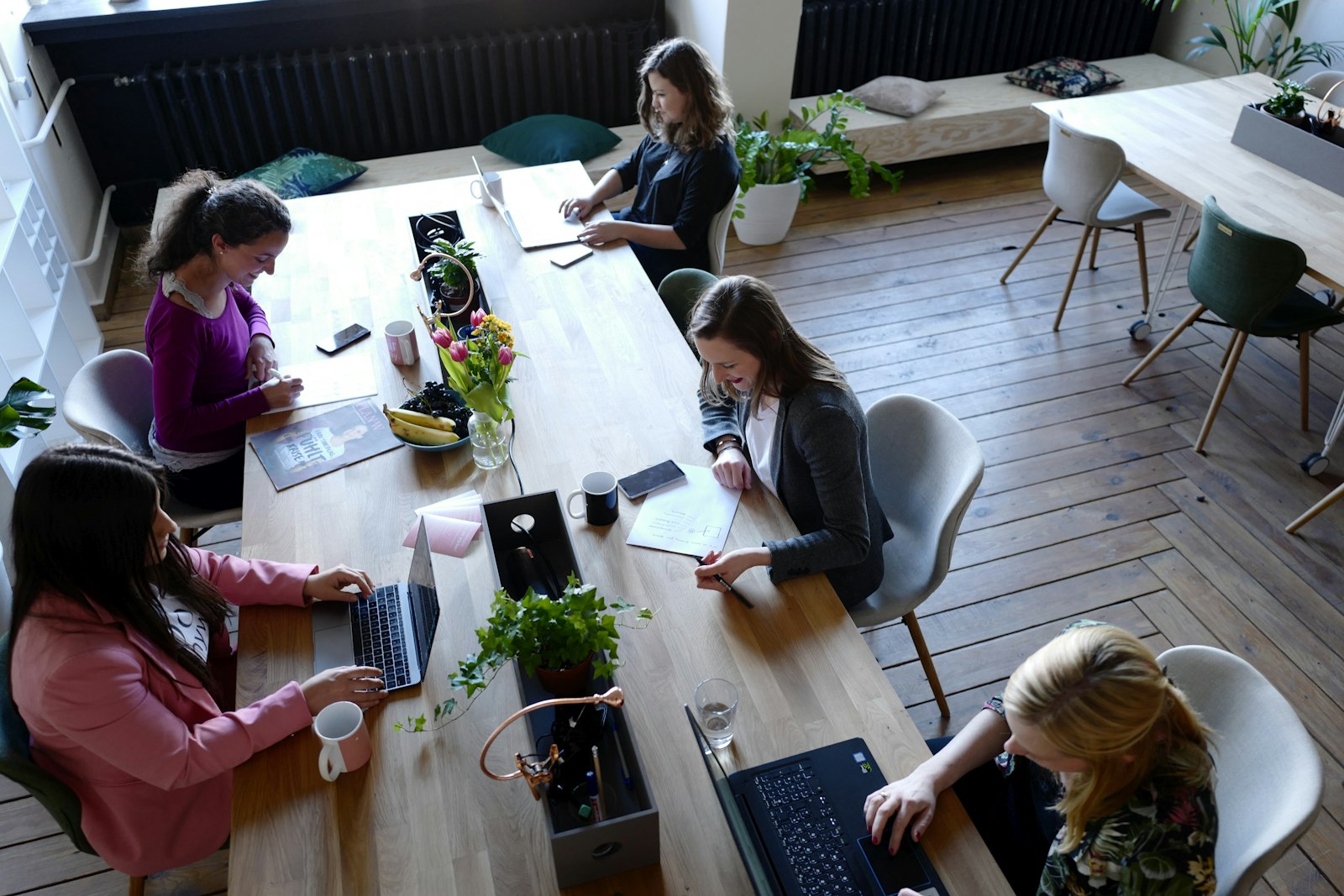 A team working together around a long table